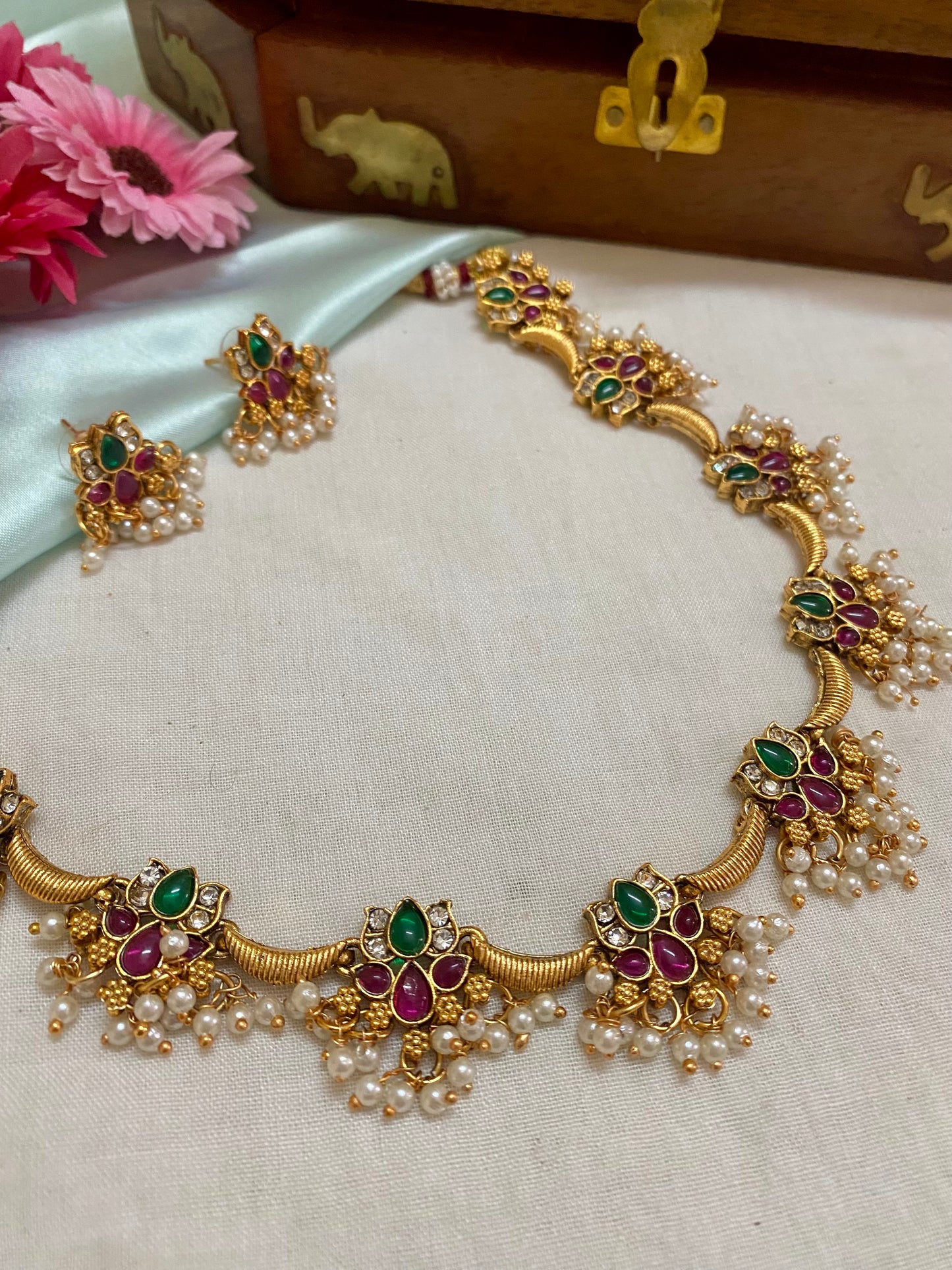 Goldplated pearl hanging 9 charm Kundan lotus necklace set