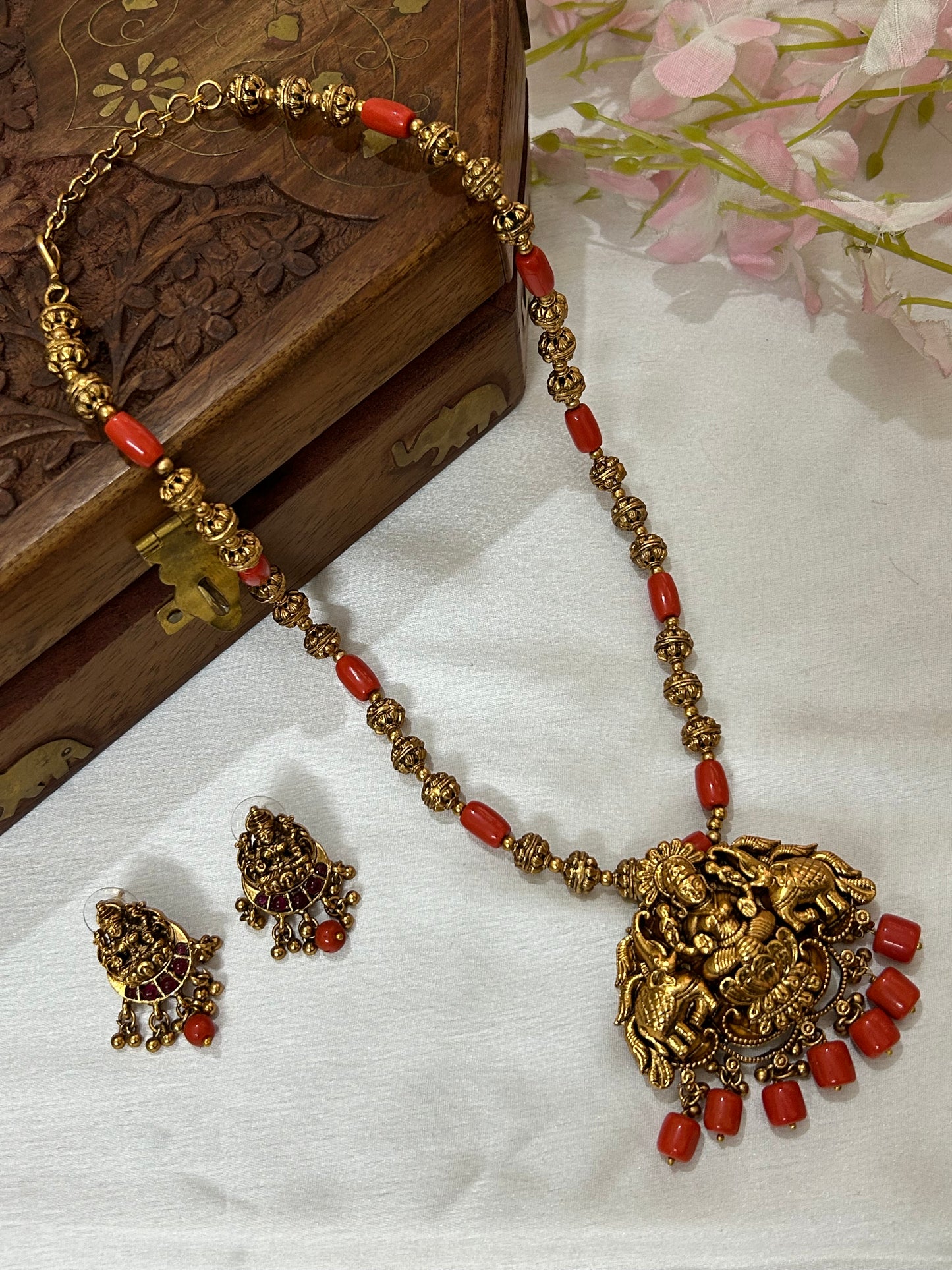 Gold Plated Antique Lakshmi Necklace set embedded with Corals & Nakshi balls