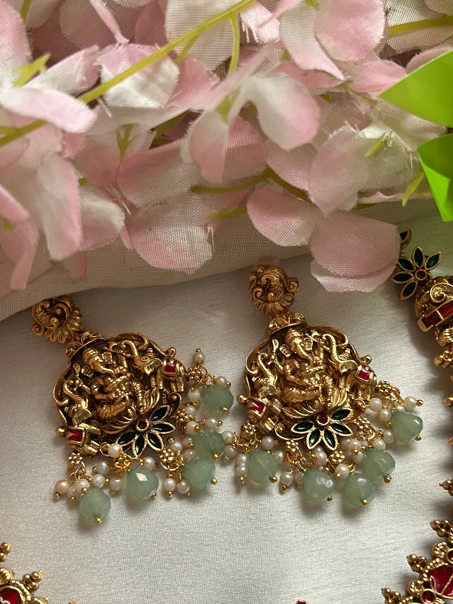 Premium pastel green beaded Nagas Necklace set with lord Ganesh pendant.