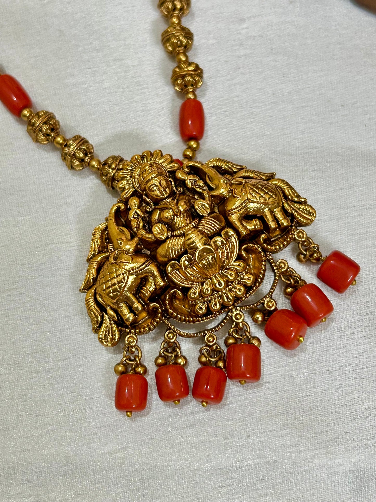 Gold Plated Antique Lakshmi Necklace set embedded with Corals & Nakshi balls