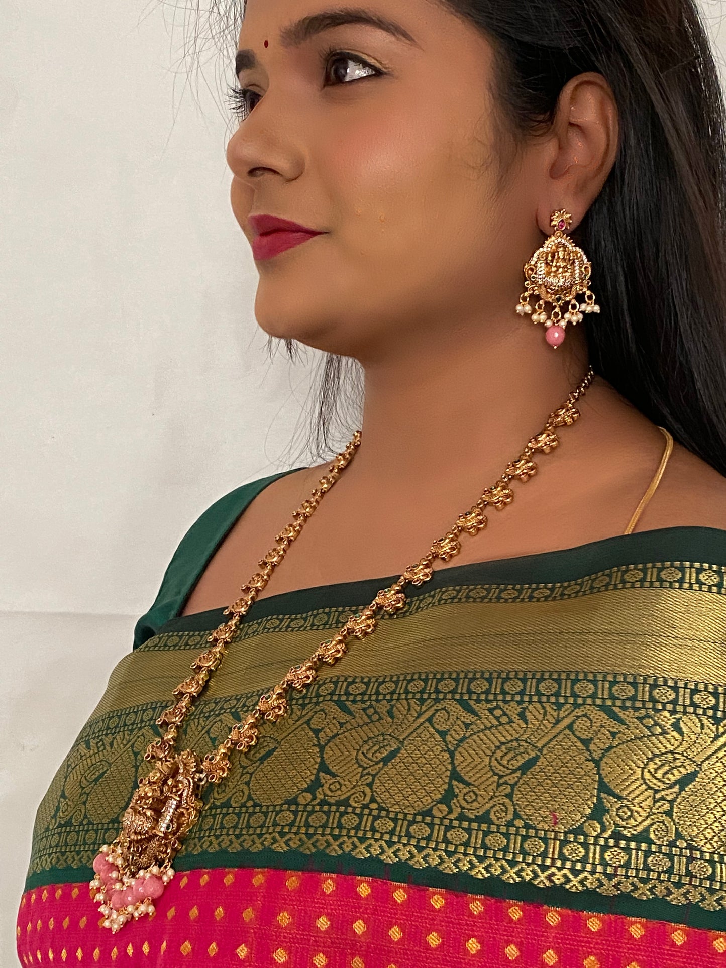 Luxehara's Long Haara with Lakshmi pendant, trending Monalisa beads with matching earrings.