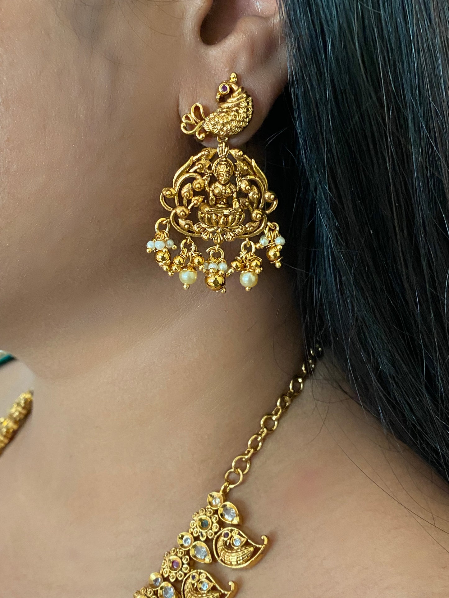Luxehara's Long Mango haaram with Lakshmi pendant along with earrings.