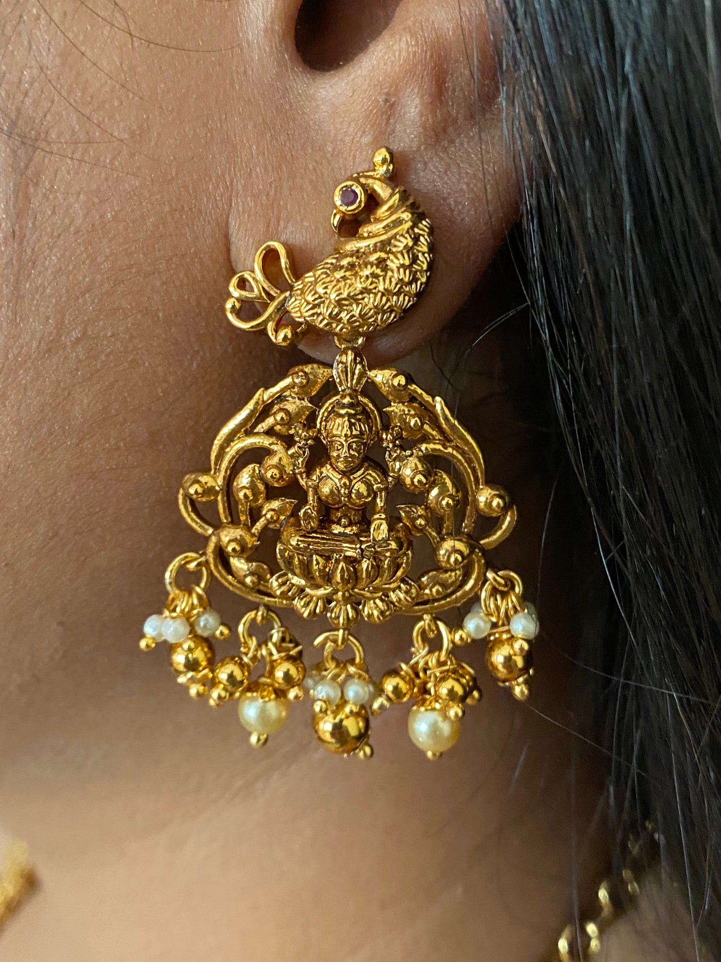 Luxehara's Long Mango haaram with Lakshmi pendant along with earrings.
