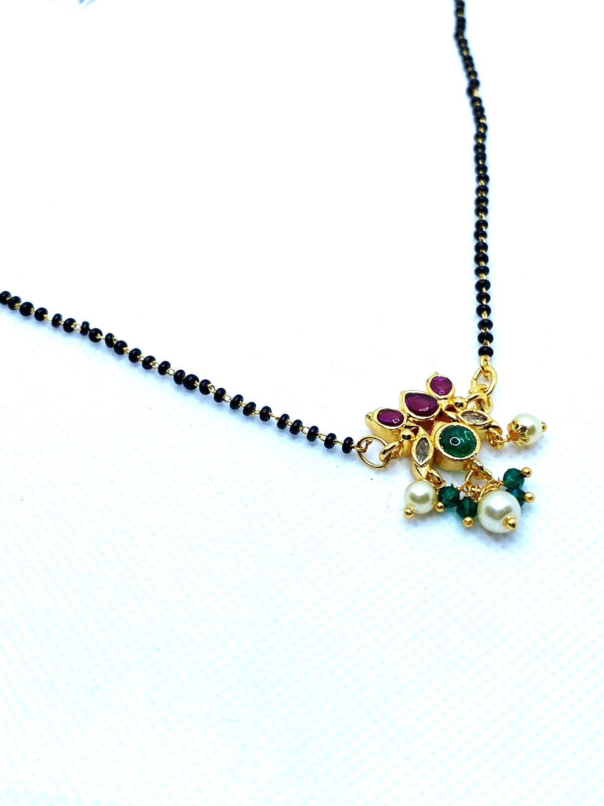 Luxehara's Black beads with Lotus Pendant And Ruby & Emerald Stones & hanging Pearls