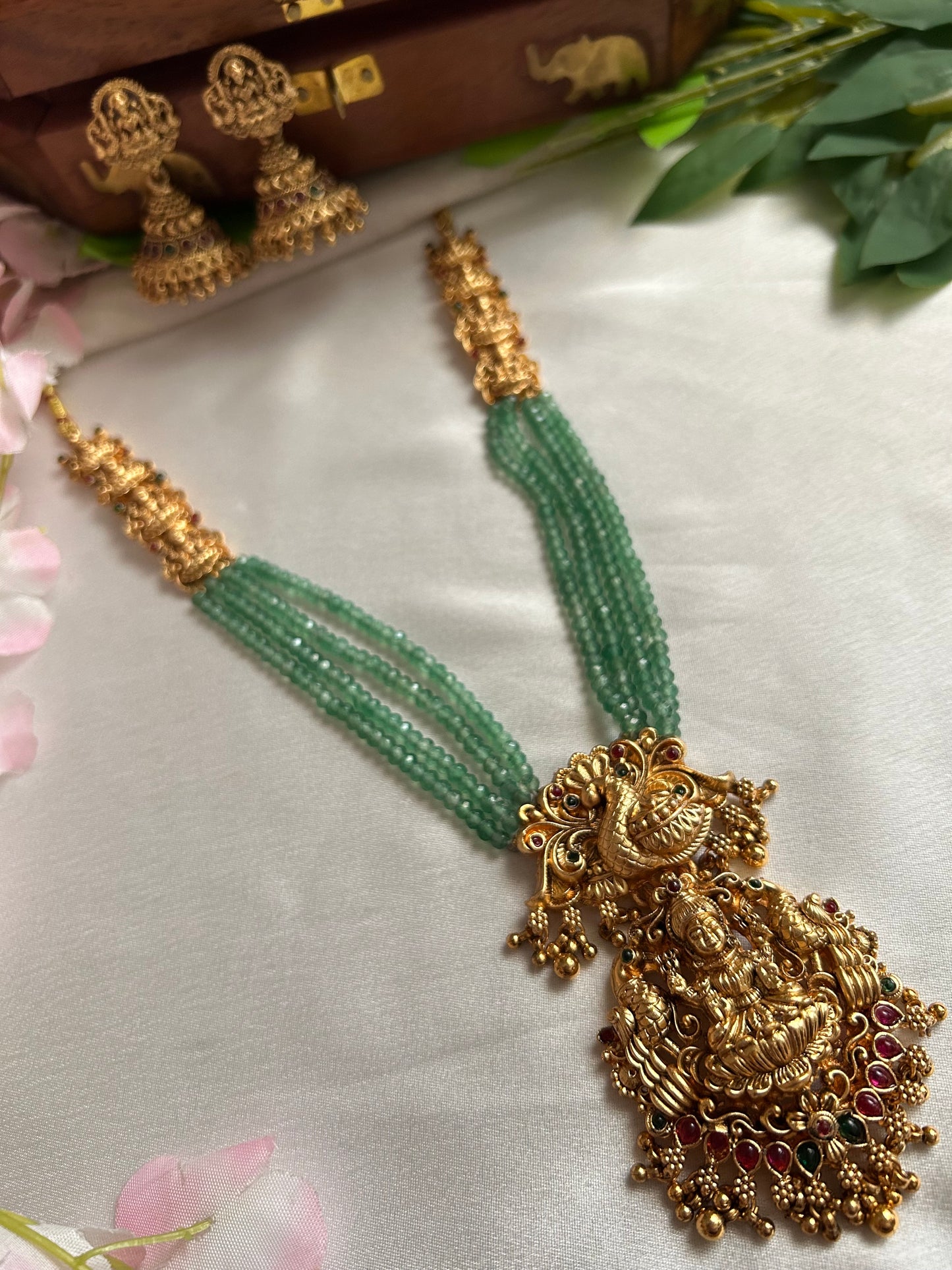 Gold plated green beaded Long Haaram with heavy Laksmi pendant.