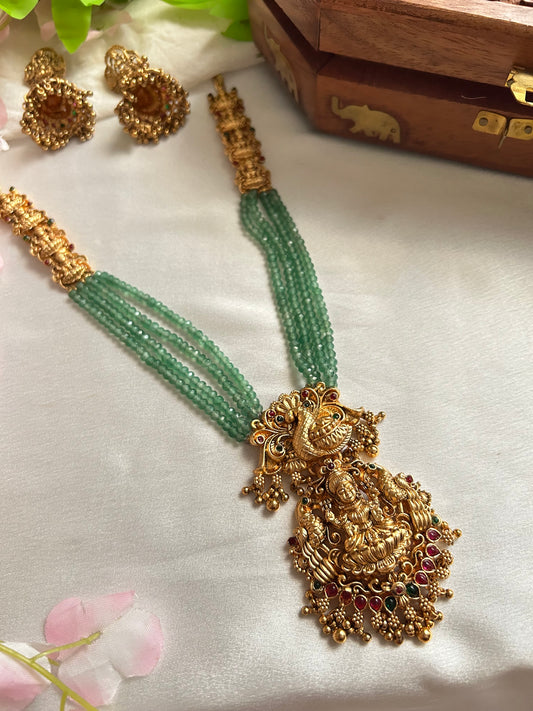 Gold plated green beaded Long Haaram with heavy Laksmi pendant.