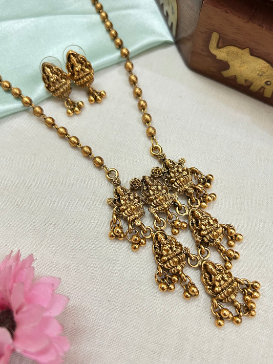 Gold plated small beads chain set with 3 layered Lakshmi pendants.