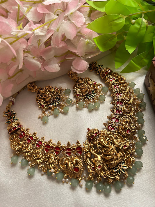 Premium pastel green beaded Nagas Necklace set with lord Ganesh pendant.