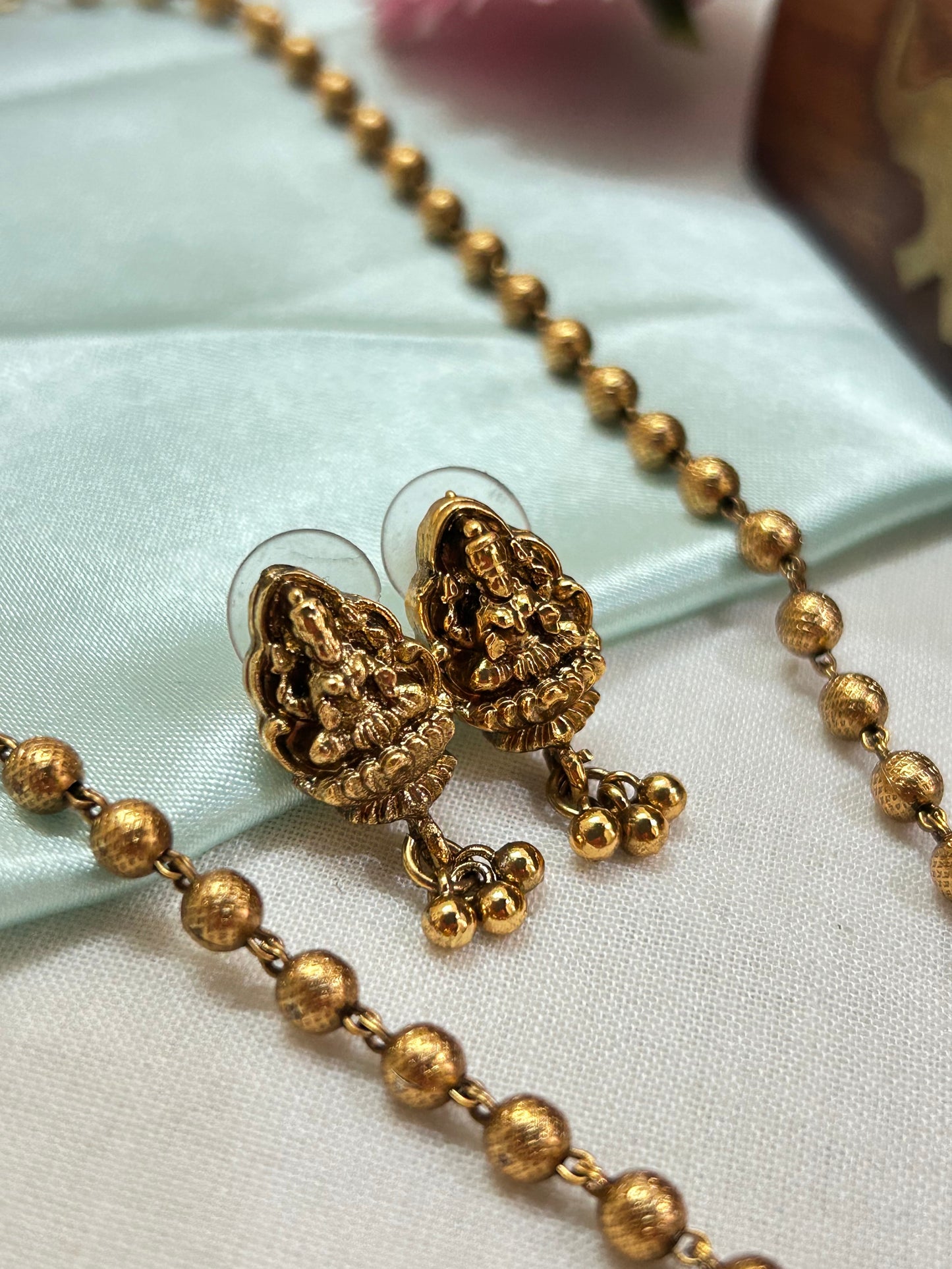 Gold plated small beads chain set with 3 layered Lakshmi pendants.