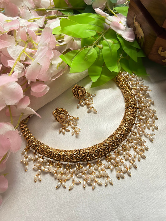 Gold plated Hasli Necklace set with handing rice pearls.