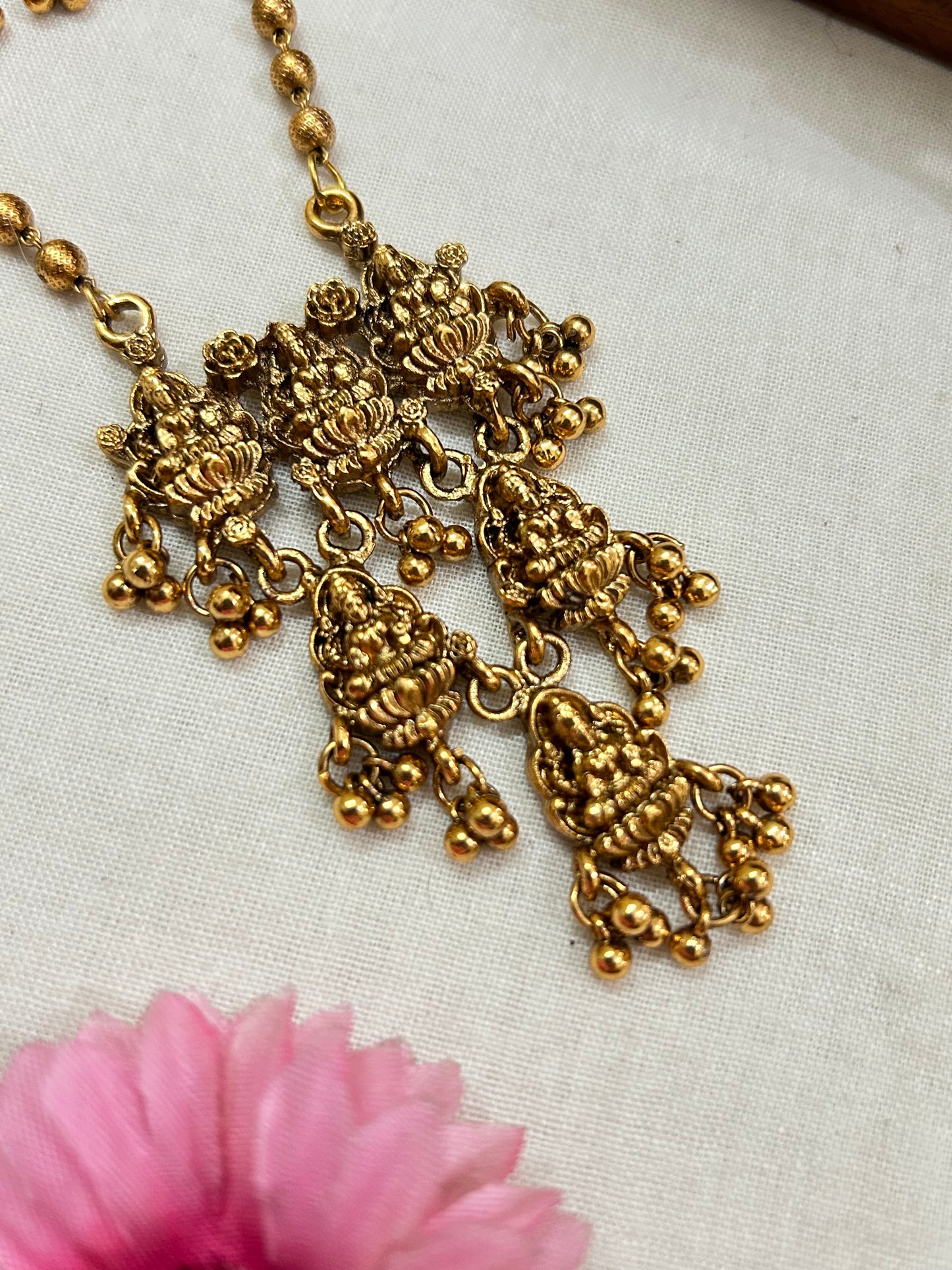 Gold plated small beads chain set with 3 layered Lakshmi pendants.