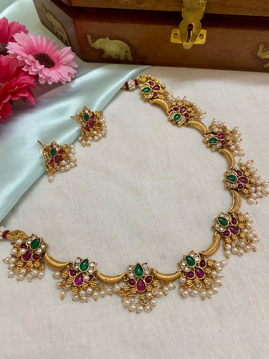 Goldplated pearl hanging 9 charm Kundan lotus necklace set