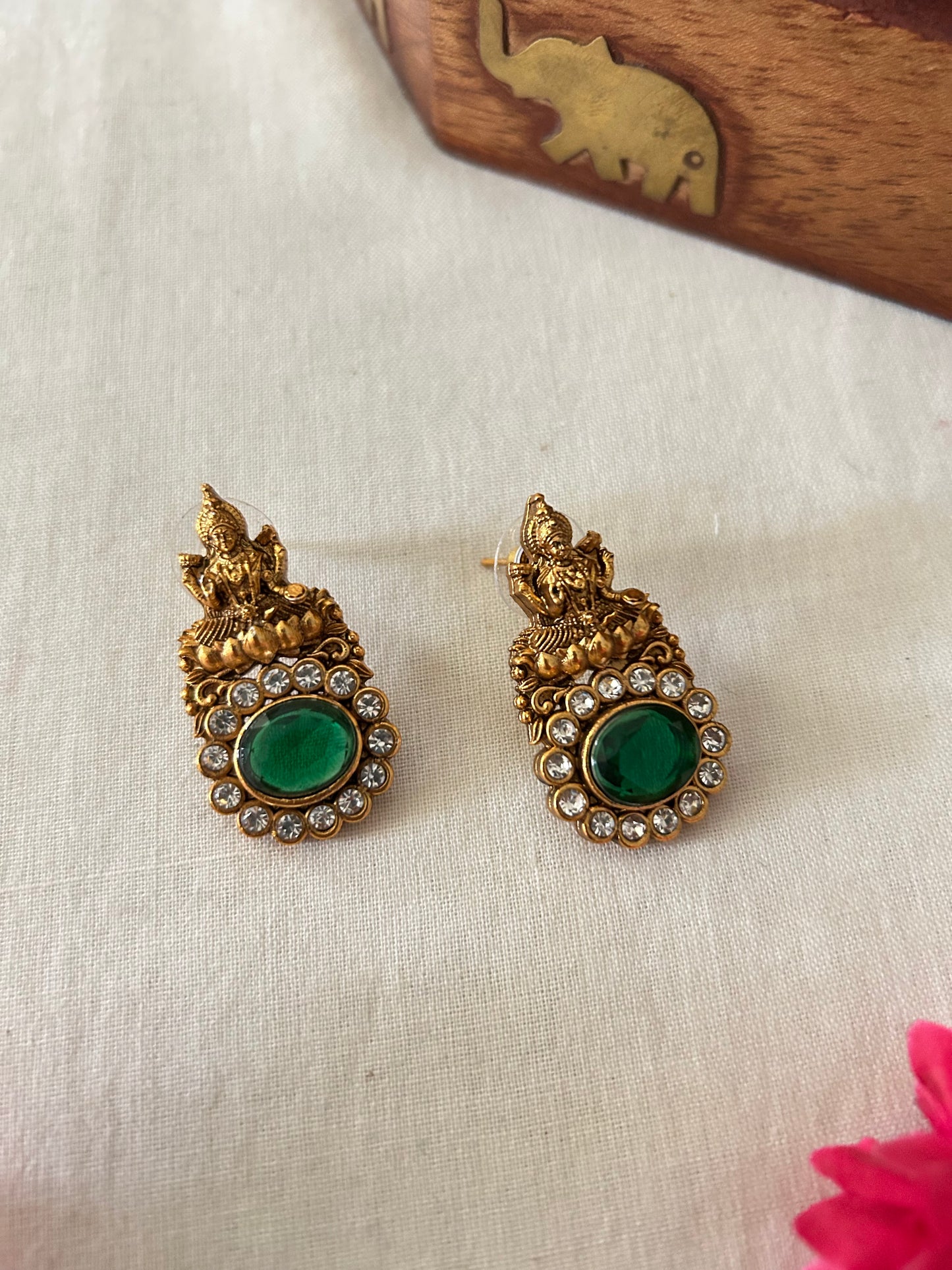Gold Plated Invisible Necklace with Lakshmi Pendant - Embedded with Oval Shaped Emerald Green