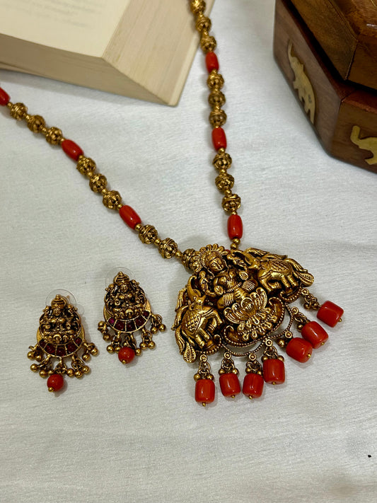Gold Plated Antique Lakshmi Necklace set embedded with Corals & Nakshi balls