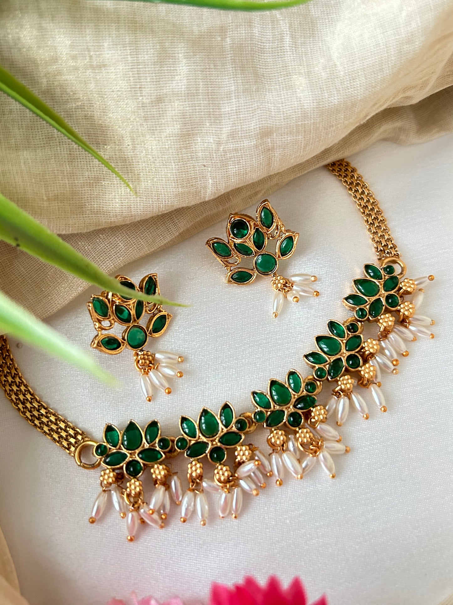 Gold Plated green stoned Choker set with Rice pearls