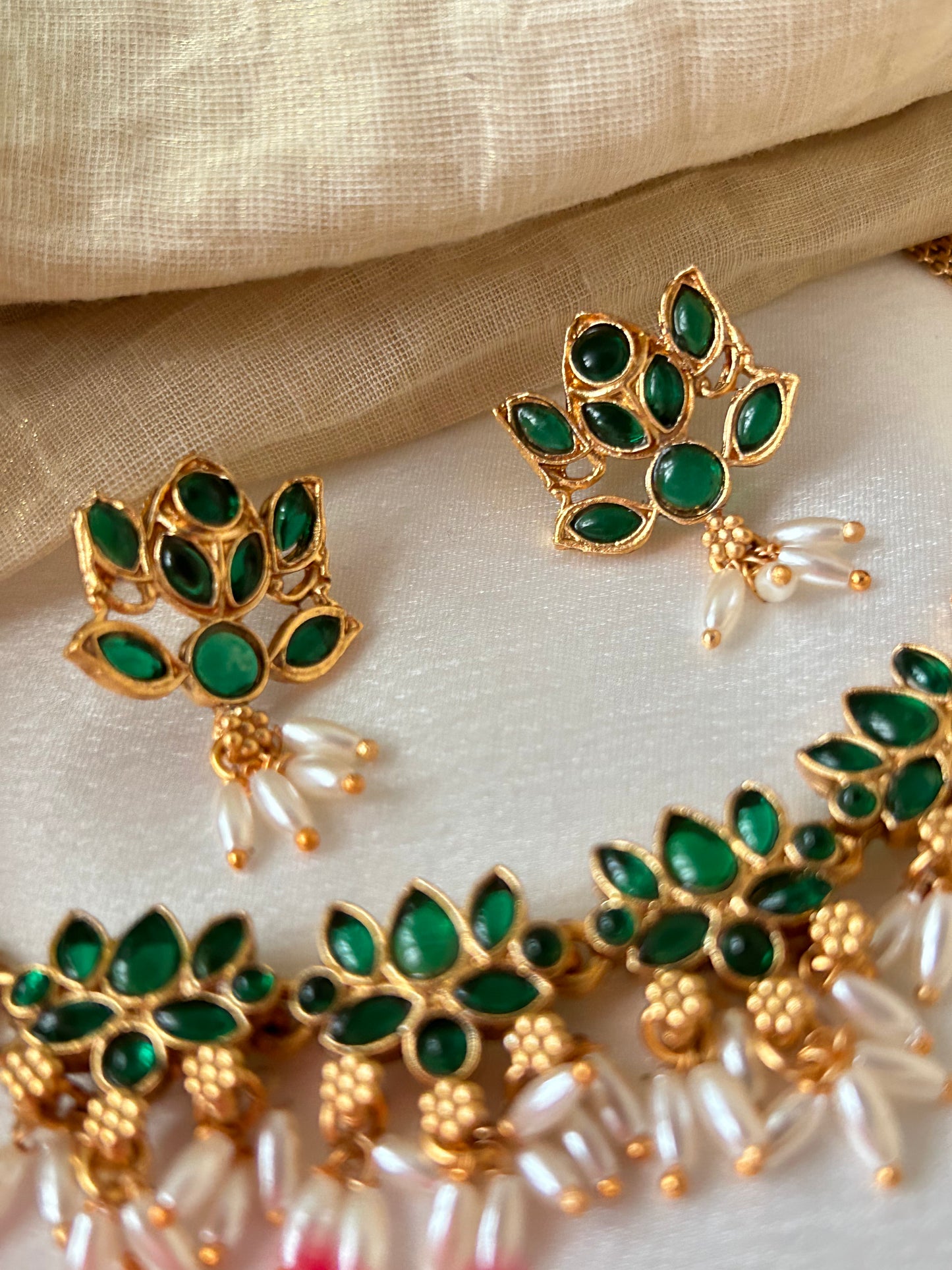 Gold Plated green stoned Choker set with Rice pearls
