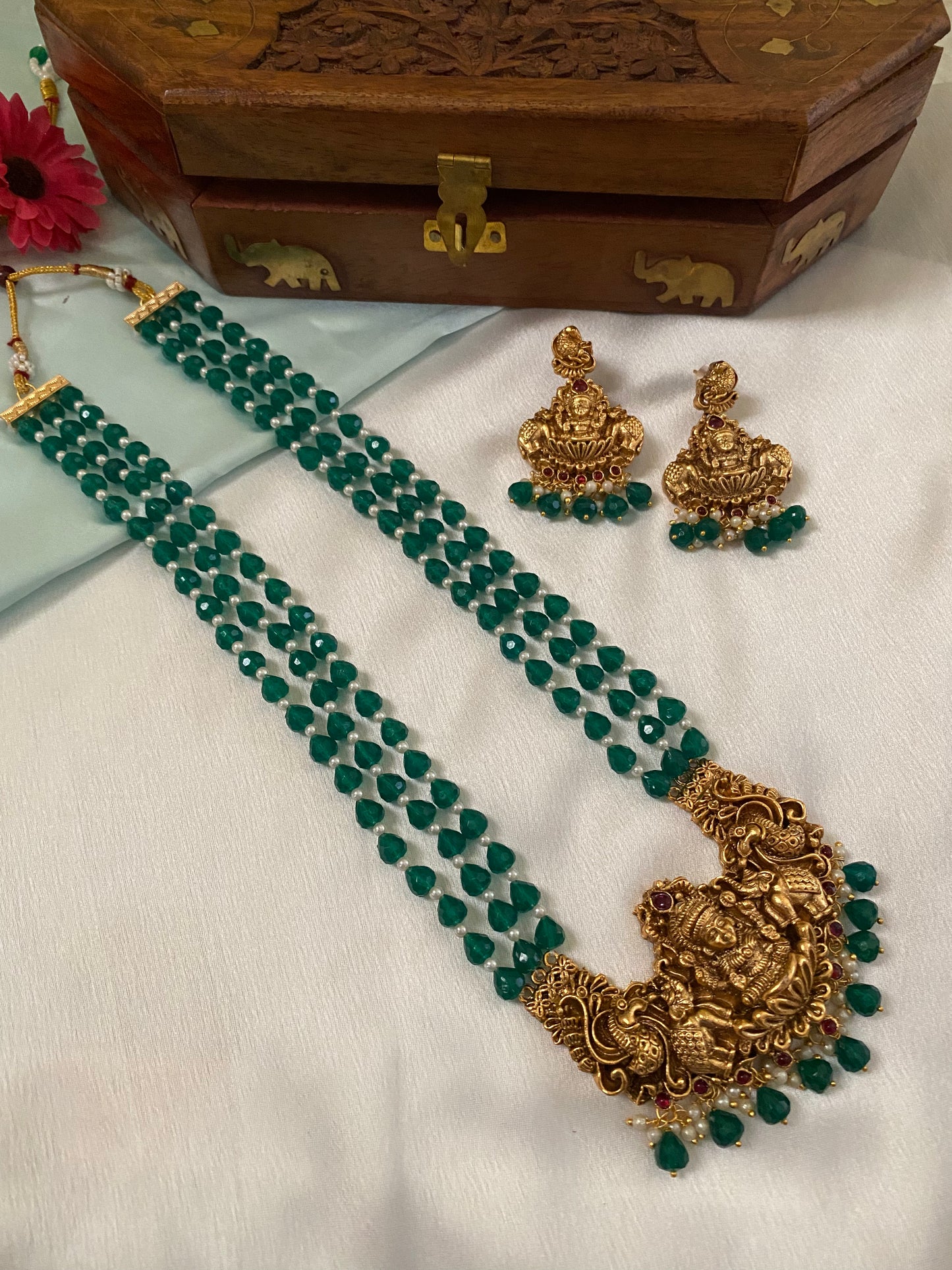 Gold Plated Long Haram with heavy laksmi pendant and medium green beads