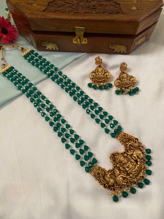 Gold Plated Long Haram with heavy laksmi pendant and medium green beads