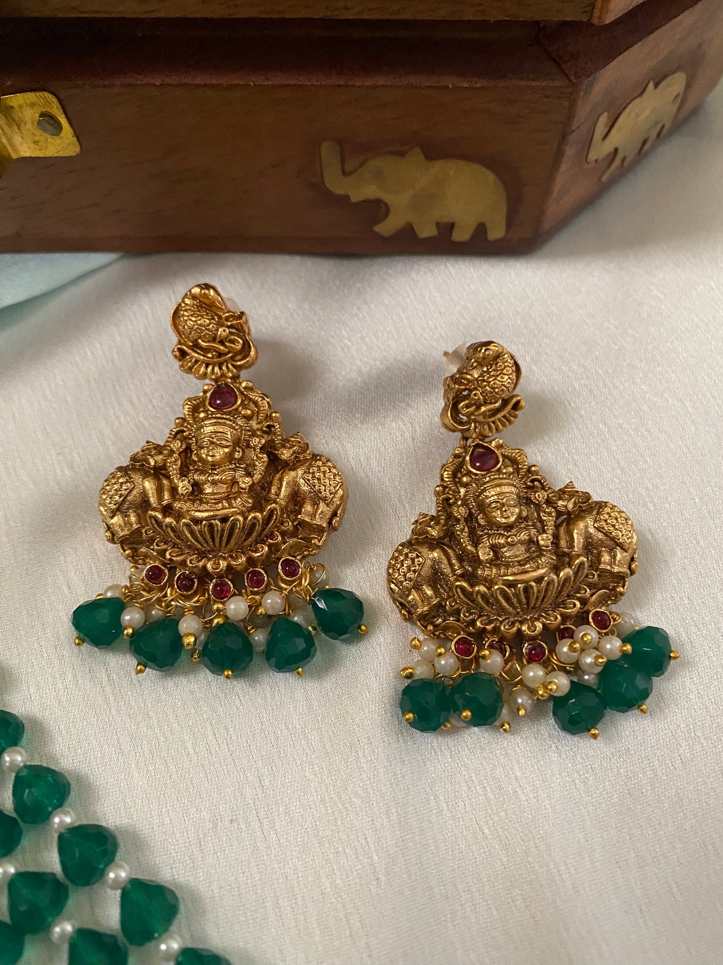 Gold Plated Long Haram with heavy laksmi pendant and medium green beads