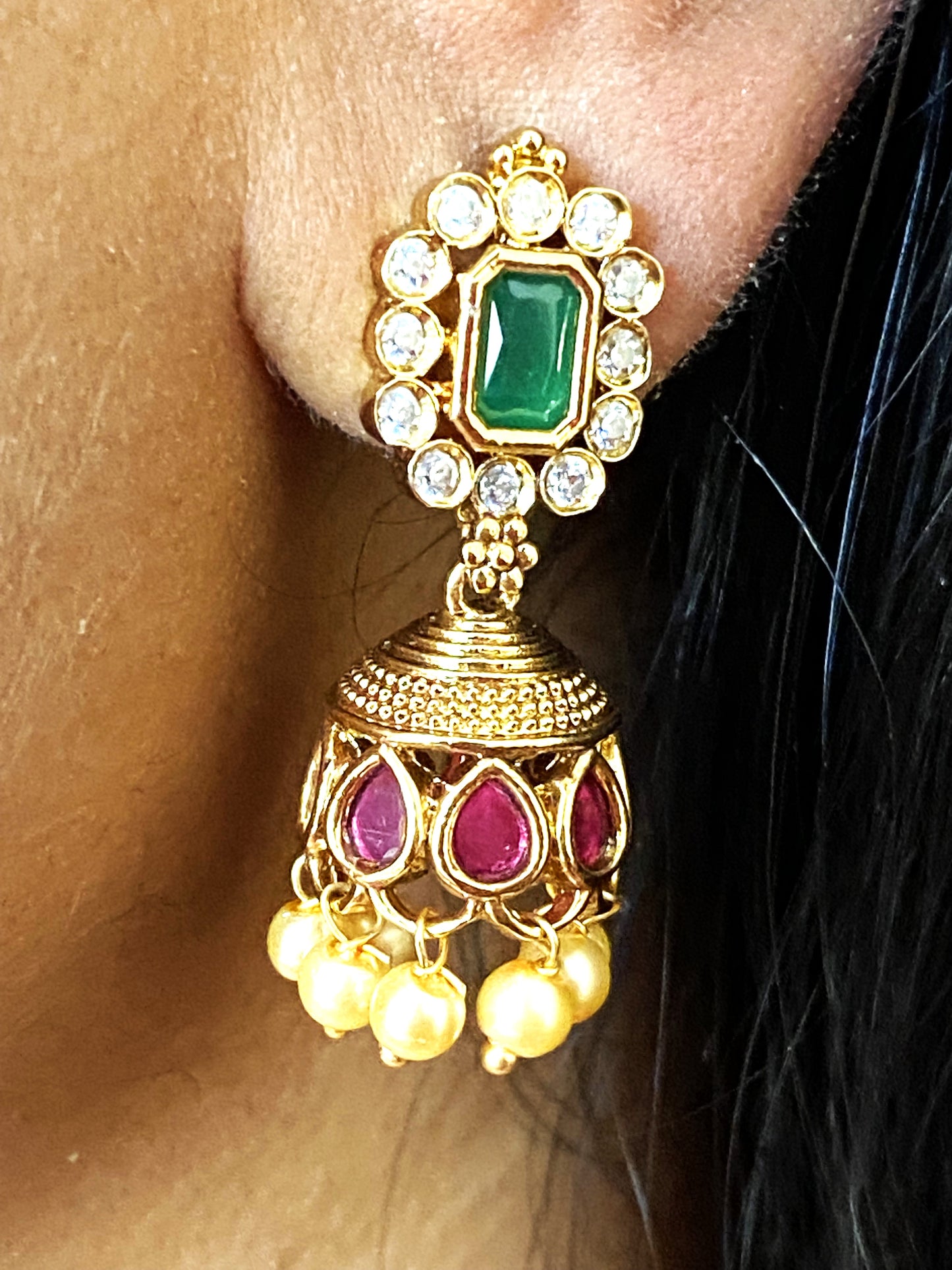 LuxeHara Ram Parivar Choker along with earrings with added red and green stones and hanging pearls.