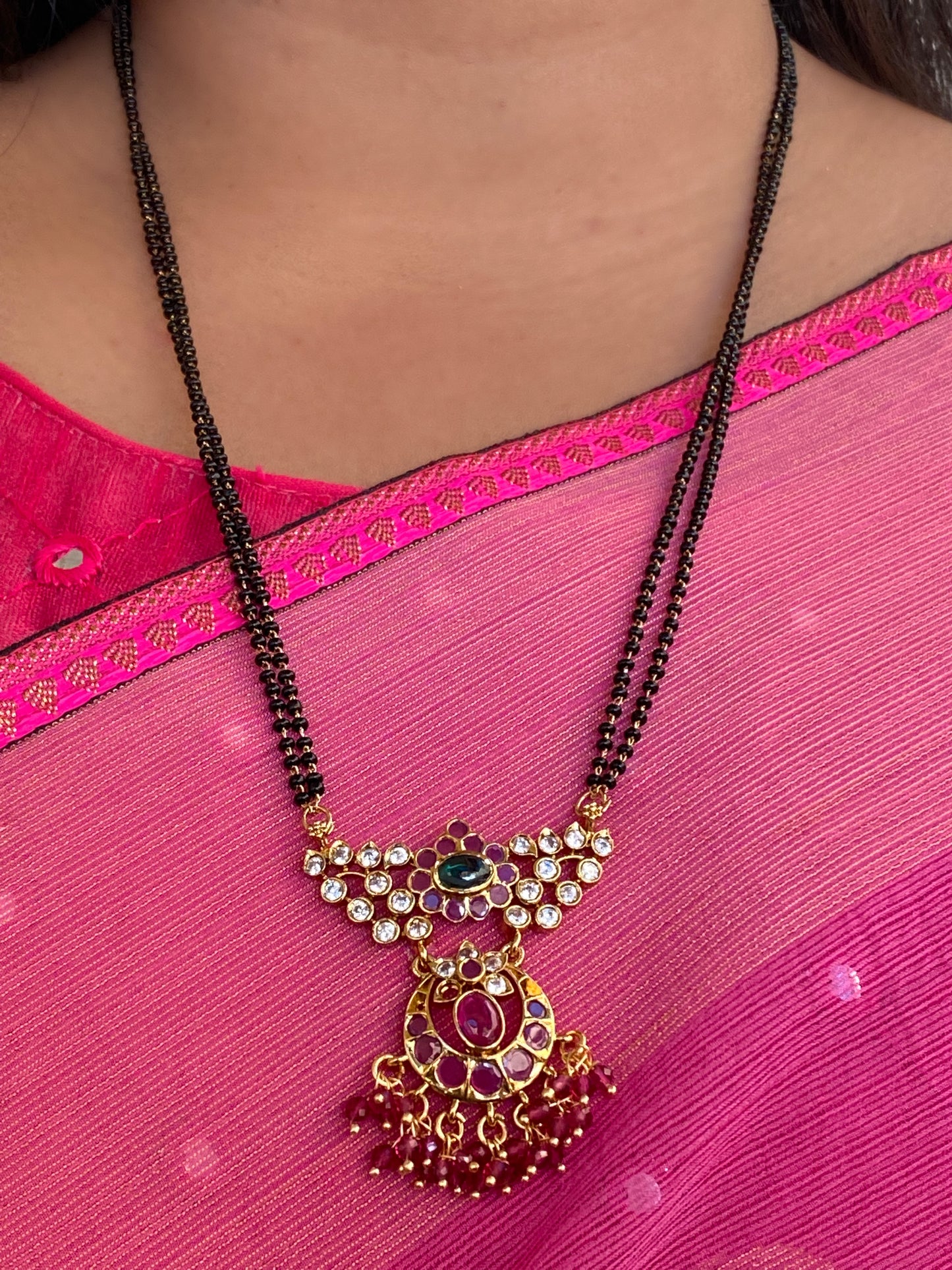 Luxehara's blackbeads with earrings & large pendant embedded with red & ruby stones with added cz stones.