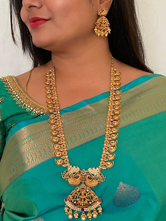 Luxehara's Long Mango haaram with Lakshmi pendant along with earrings.