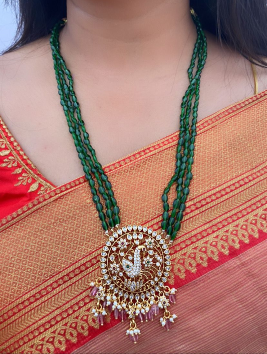 Luxehara's Long set jewellery with green monalisa beads and heavy pendant embedded with cz stones, pearls and monalisa beads.