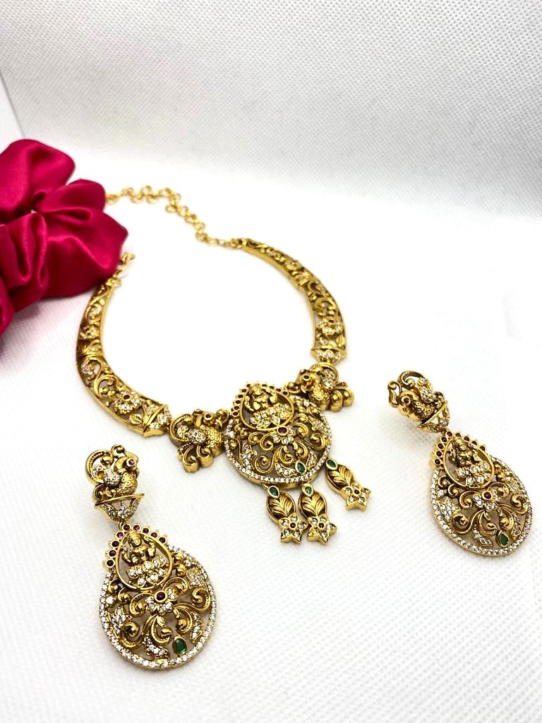 Luxehara's Necklace set with lakshmi pendant and matching earrings.