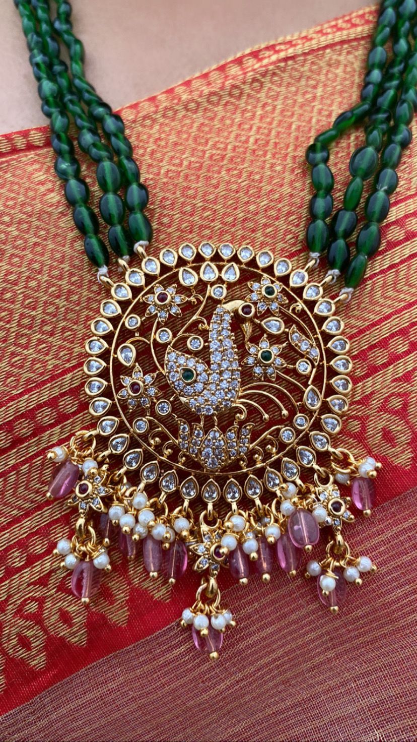 Luxehara's Long set jewellery with green monalisa beads and heavy pendant embedded with cz stones, pearls and monalisa beads.