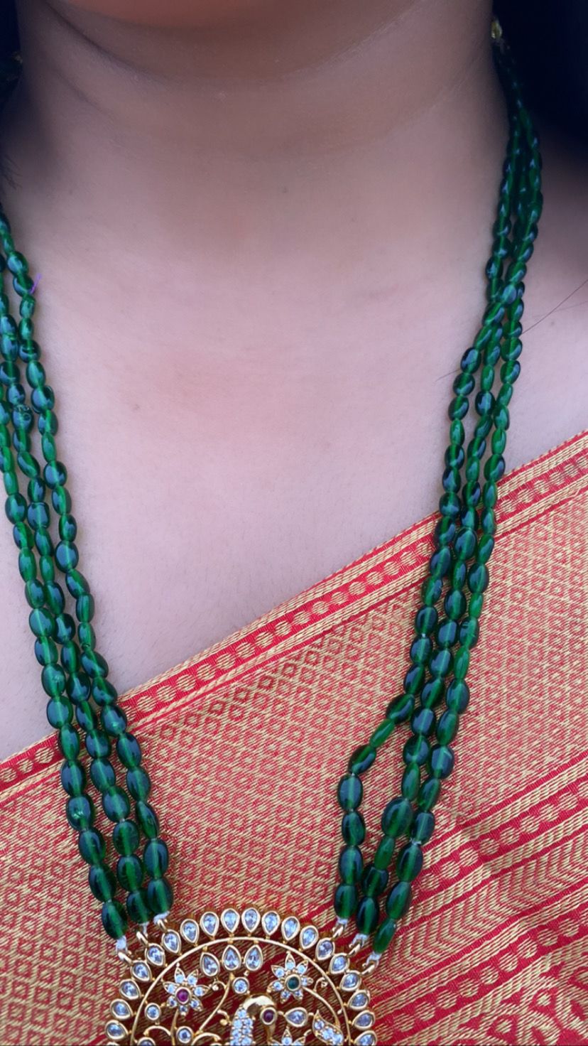 Luxehara's Long set jewellery with green monalisa beads and heavy pendant embedded with cz stones, pearls and monalisa beads.